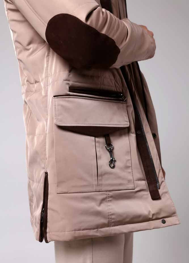 Beige winter coat with dark fur trim on a light gray background