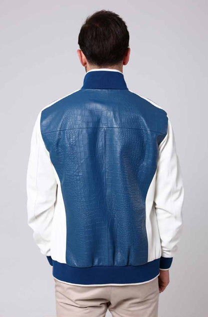 Man wearing a blue and white jacket on a gray background