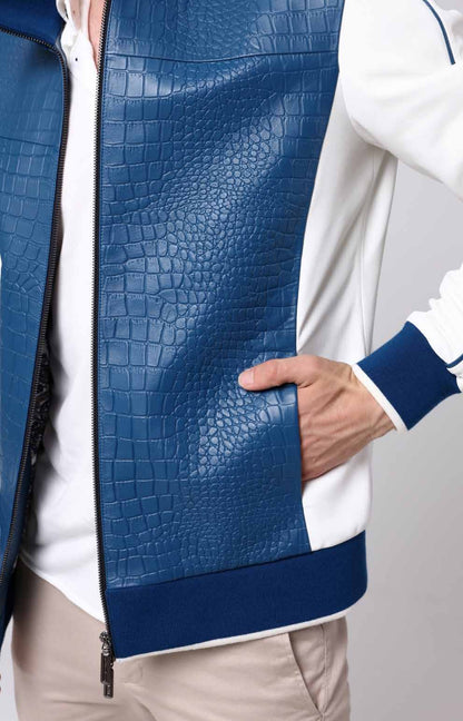 Blue textured jacket with a white shirt underneath on a neutral background