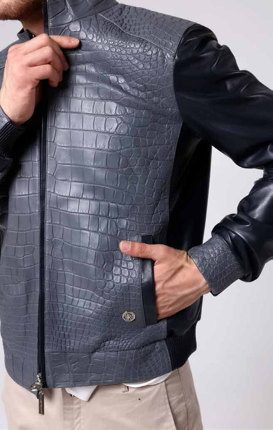 Man wearing a gray textured leather vest with a white background