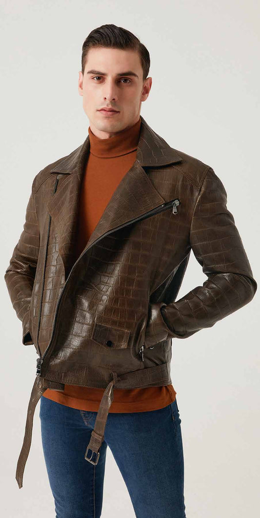 Man wearing a brown leather jacket over an orange sweater on a white background