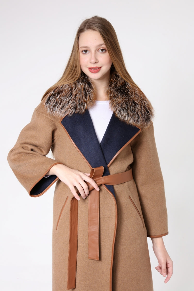 Woman wearing a brown coat with fur collar and belt on a white background