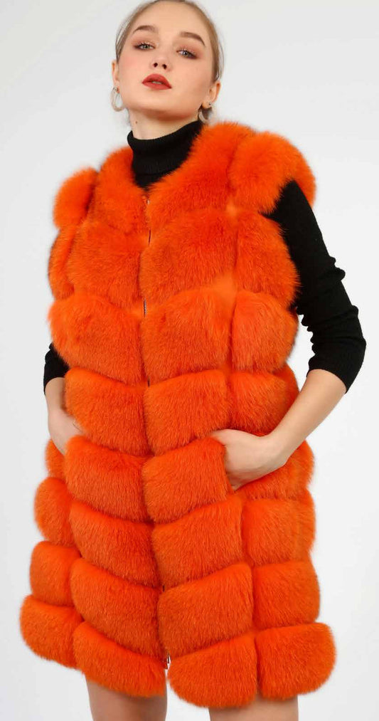 Woman wearing an orange fox fur vest on a white background
