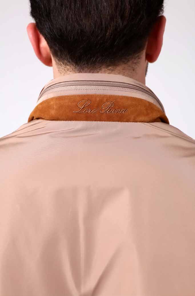 Beige jacket with brown collar on a white background