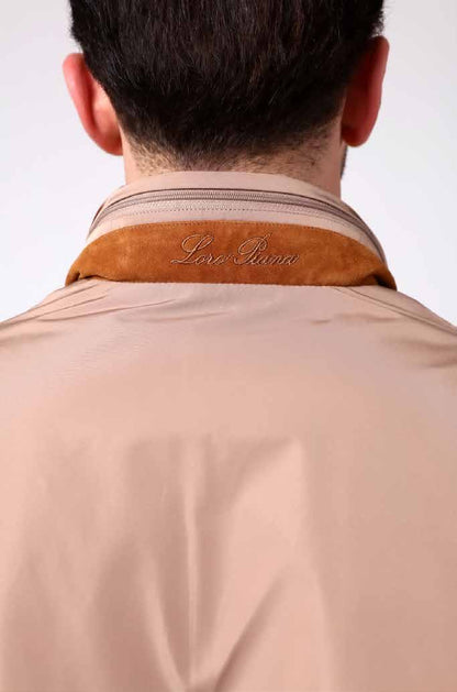 Beige jacket with brown collar on a white background