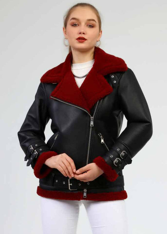 Black leather jacket with red fur trim worn by a model on a white background
