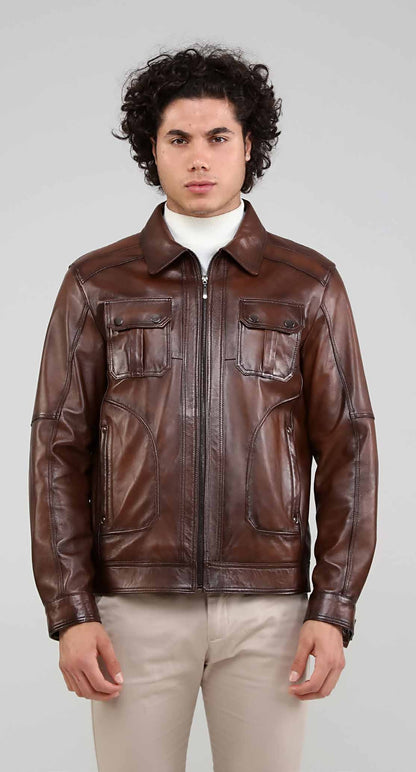 Man wearing a brown leather jacket on a plain background