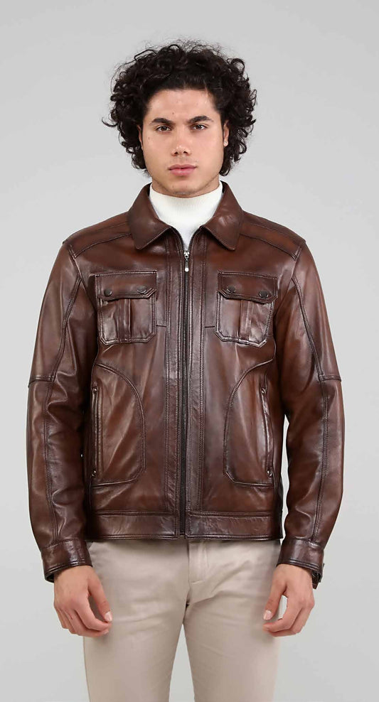 Man wearing a brown leather jacket on a plain background