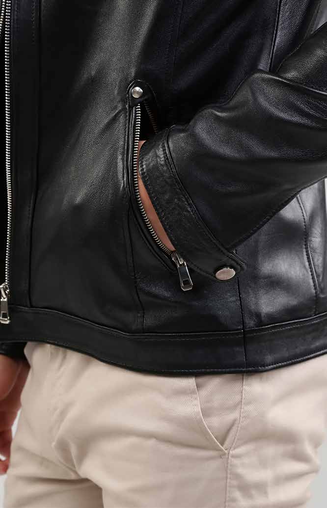 Close-up of a black leather jacket with a zipper, worn by a person.