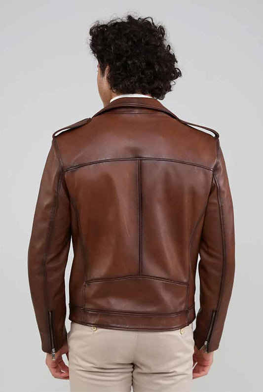 Man wearing a brown leather jacket on a plain background
