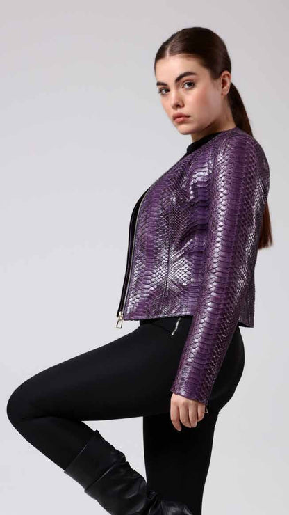 Woman wearing a purple phyton jacket and black pants on a white background