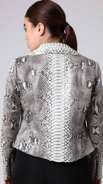 Woman wearing a phyton jacket on a plain background