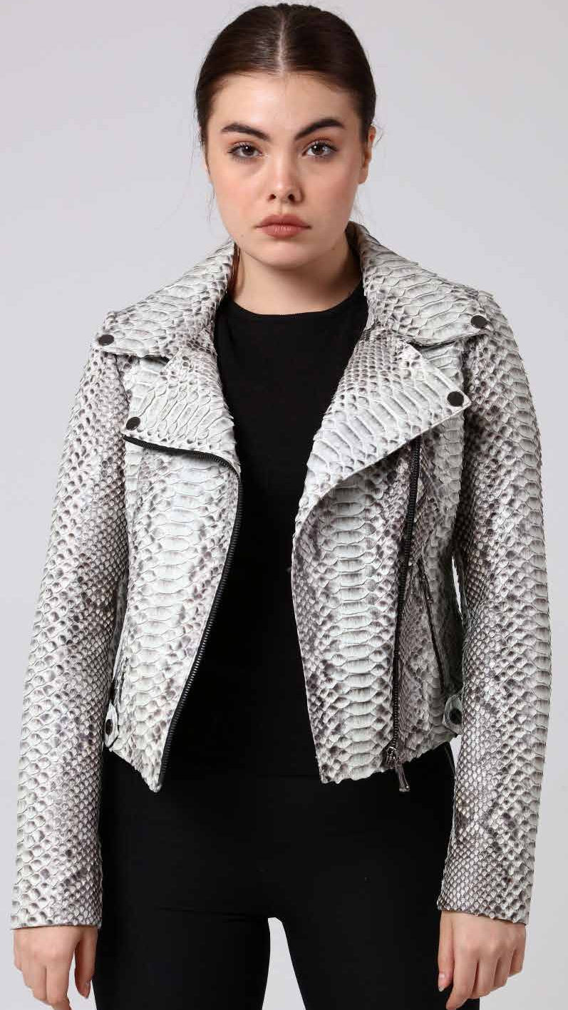 Person wearing a phyton jacket over a black outfit on a plain background