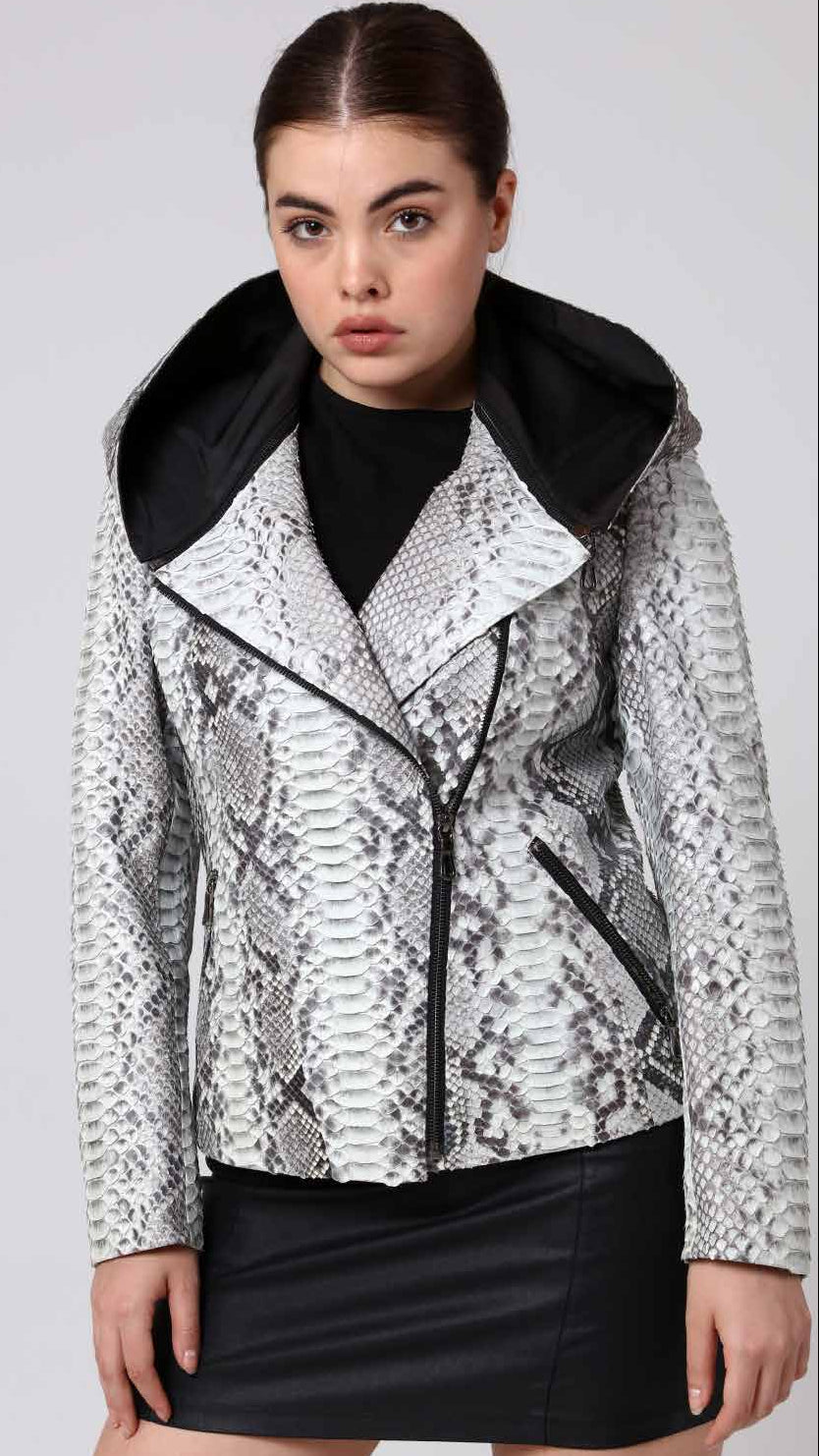 Woman wearing a phyton jacket with a black collar on a white background