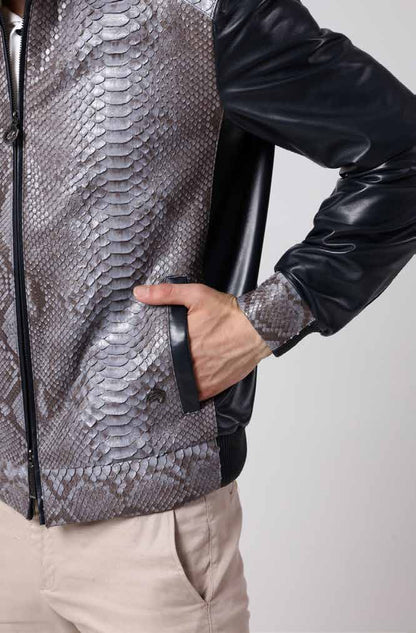 Man wearing a black leather jacket with a snake skin pattern on a white background