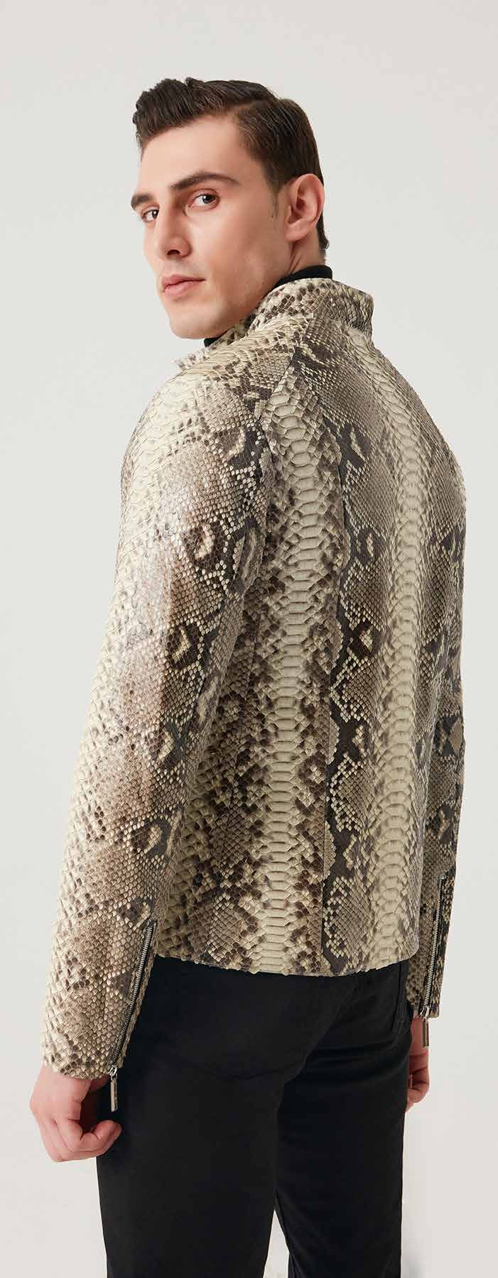 Man wearing a patterned jacket against a white background