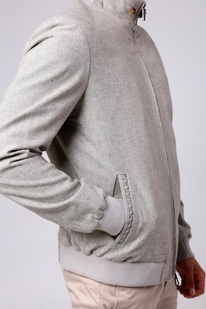 Gray hoodie with a zipper on a white background