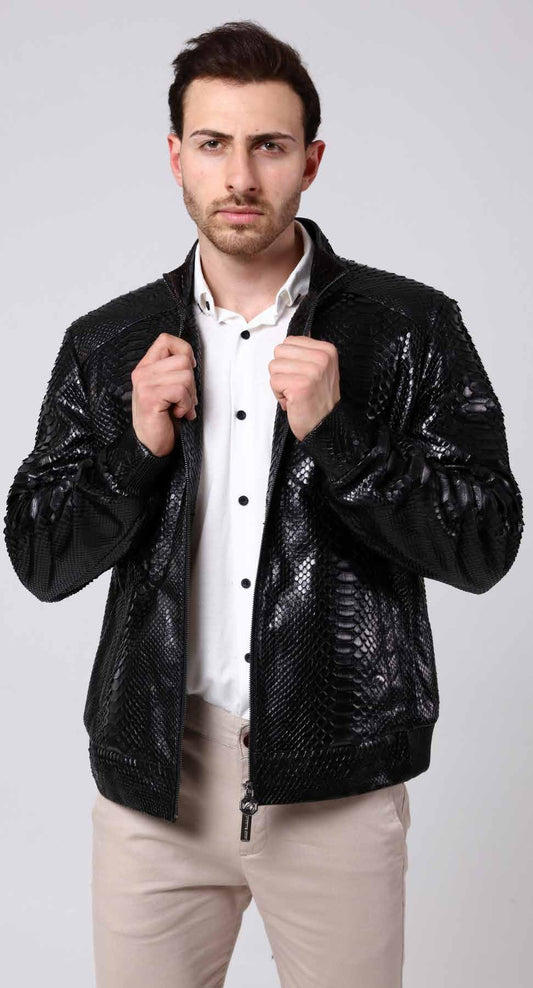 Man wearing a black sequin jacket over a white shirt on a light gray background