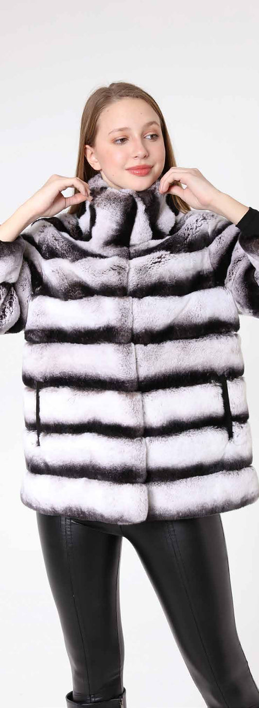 Woman wearing a fur coat with a white background