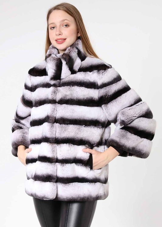 Woman wearing a fur coat with a white background