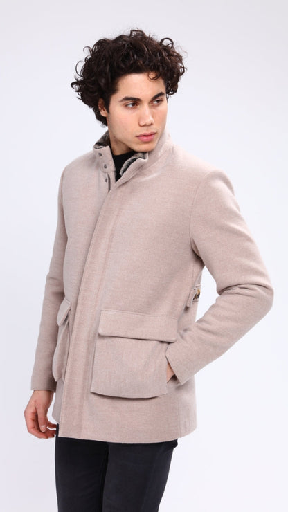 Man wearing a beige coat on a white background