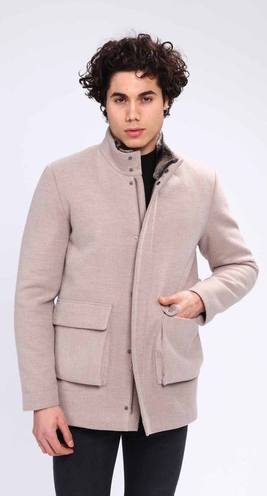 Man wearing a light brown coat on a white background