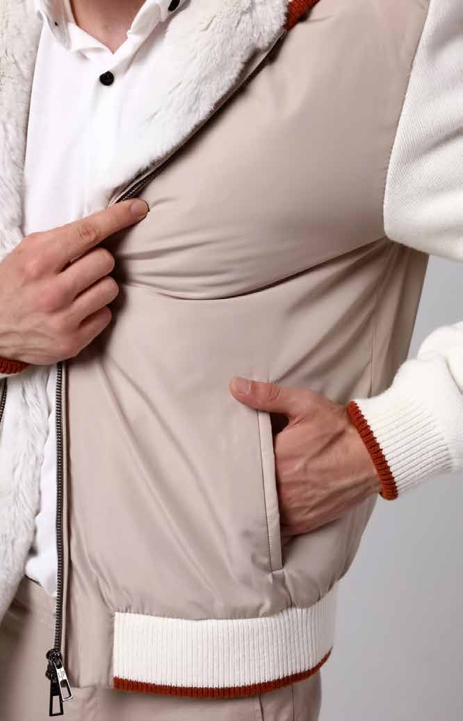 Close-up of a man wearing a beige jacket with white lining and red accents.