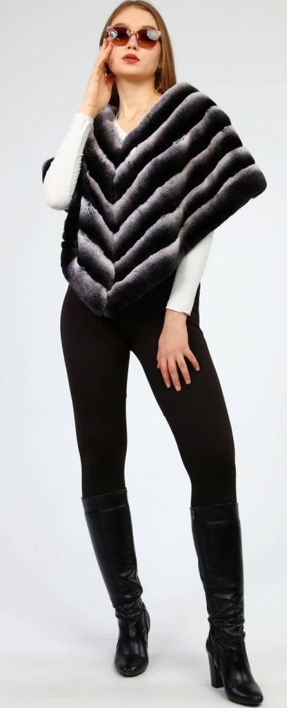 Woman wearing a black and gray rex fur shawl on a white background