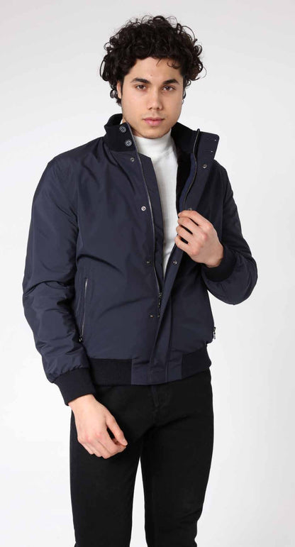 Man wearing a navy blue jacket on a white background