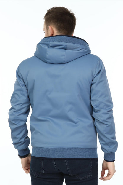 Man wearing a blue hoodie from behind on a white background