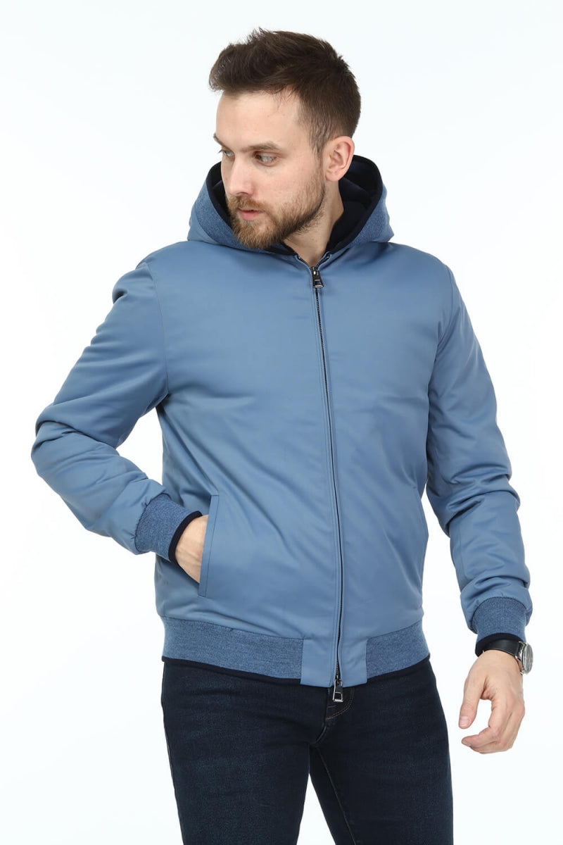 Man wearing a blue jacket on a white background