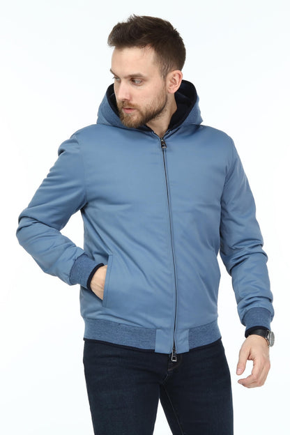 Man wearing a blue jacket on a white background