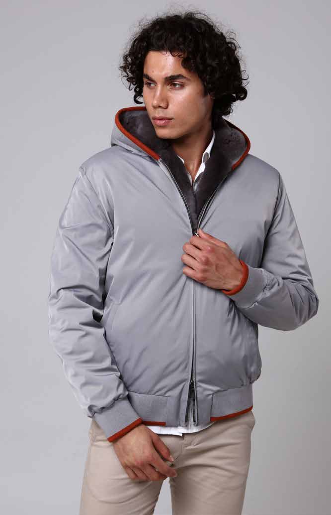 Man wearing a gray jacket with a white background