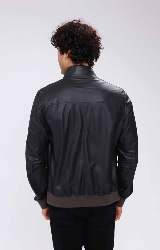 Man wearing a black leather jacket on a white background