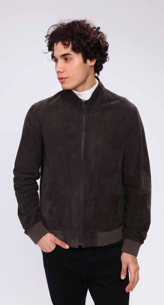Man wearing a dark brown suede jacket on a white background