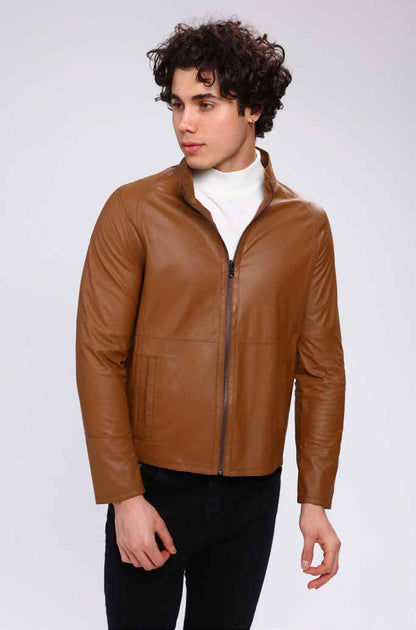 Man wearing a brown leather jacket on a white background