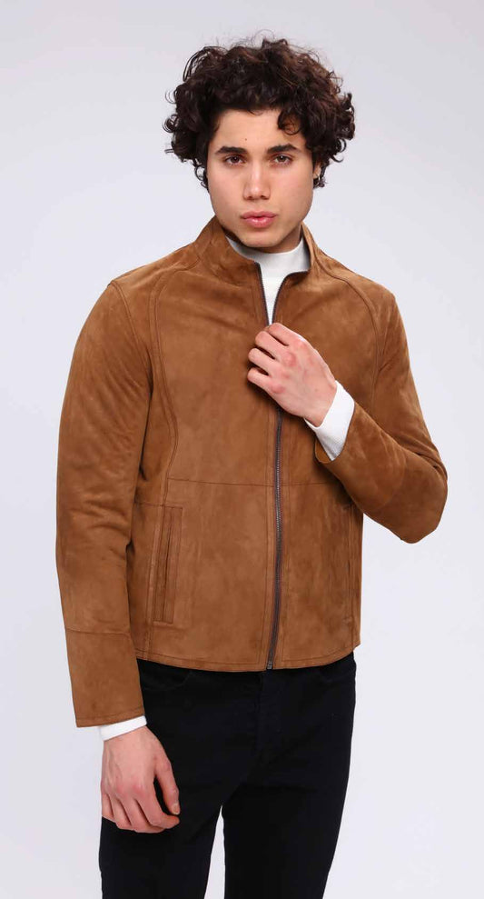 Man wearing a brown suede jacket on a white background